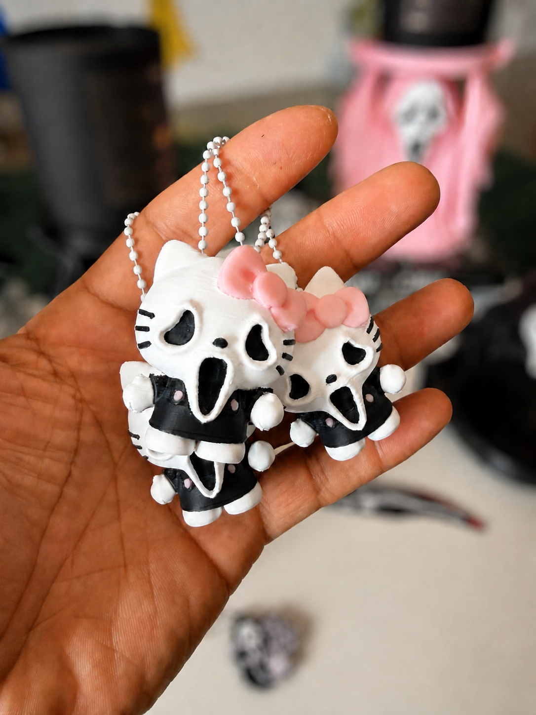 GhostFace kitty keychain group with softly blurred background