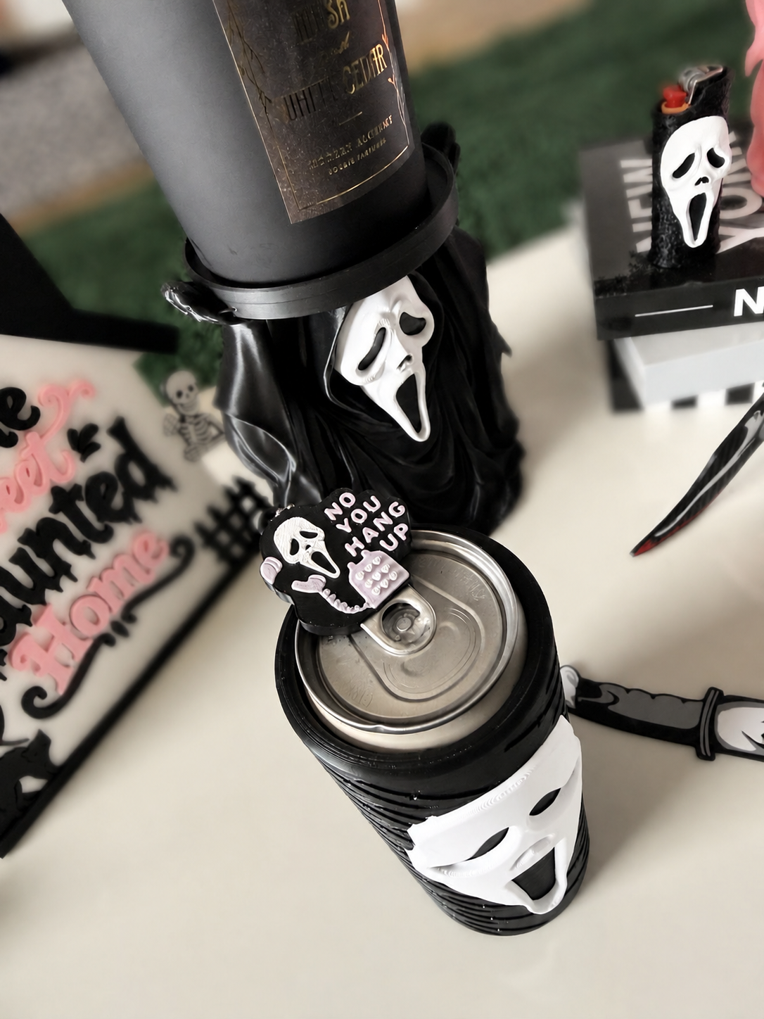 GhostFace can-tab opener top view with softly blurred background