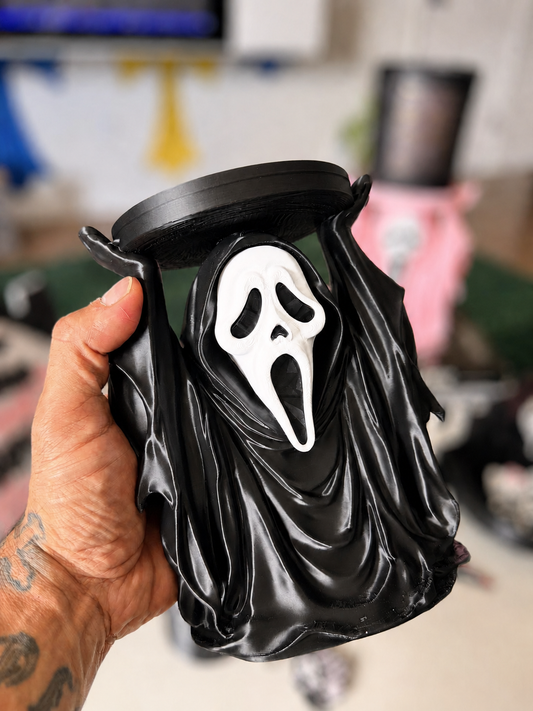 Black GhostFace candle holder detail with softly blurred background