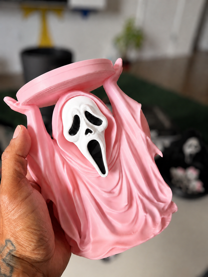 Pink GhostFace candle holder detail with softly blurred background