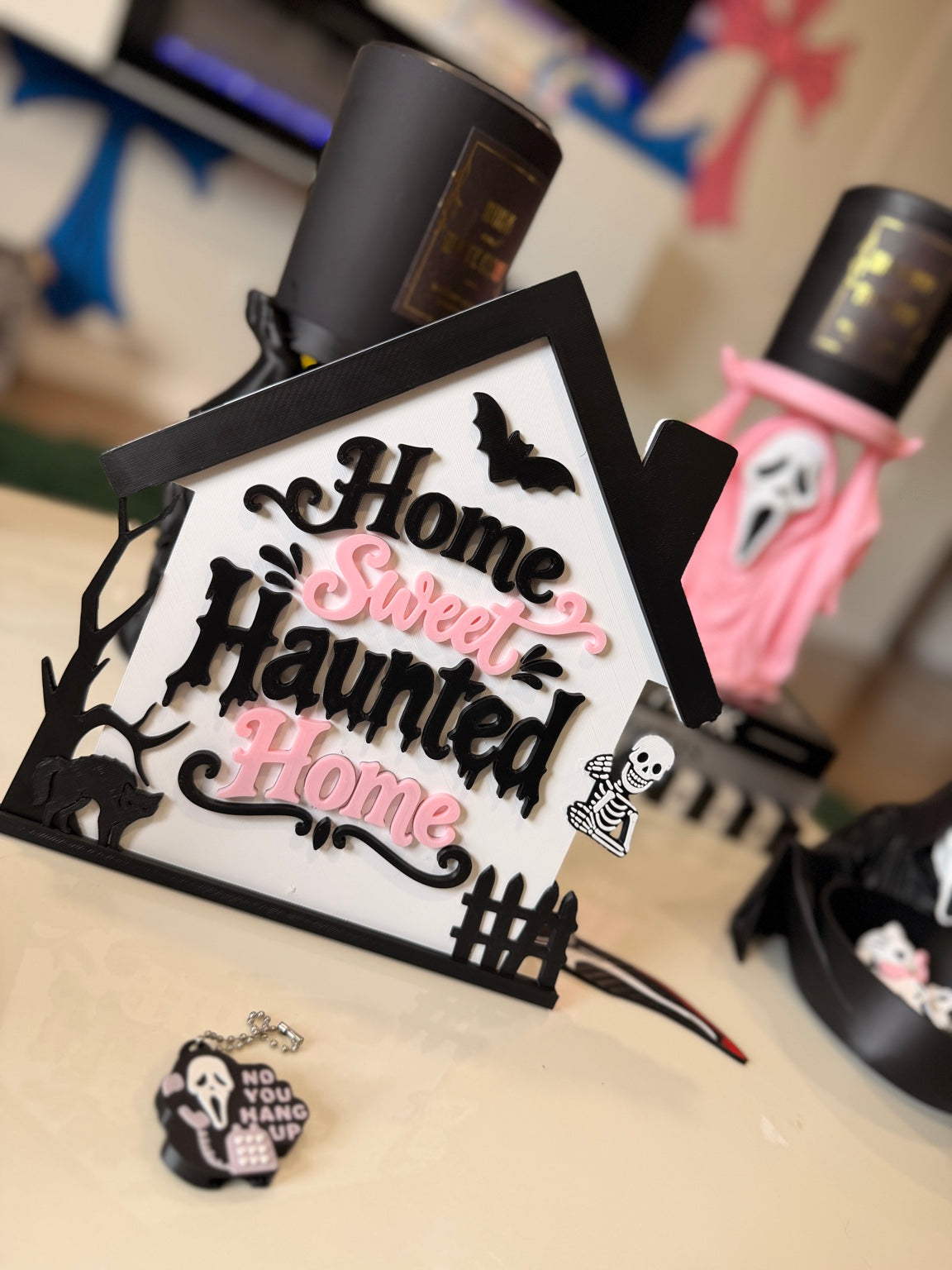 Home Sweet Haunted Home Halloween sign displayed