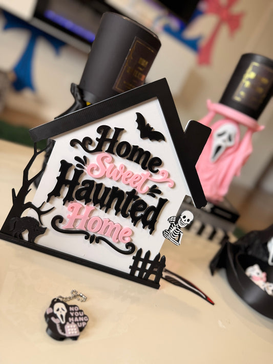 Home Sweet Haunted Home Halloween sign displayed