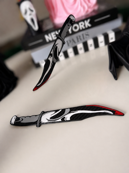 GhostFace decorative prop knives pair with cleaner whites and softly blurred background