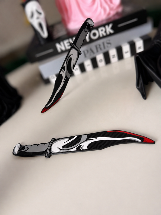 GhostFace decorative prop knives pair with cleaner whites and softly blurred background