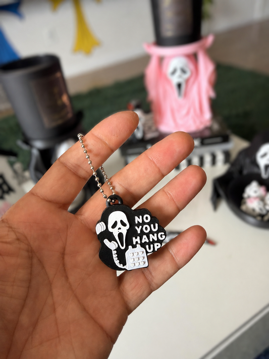 No You Hang Up GhostFace can-tab opener keychain with bright whites and softly blurred background