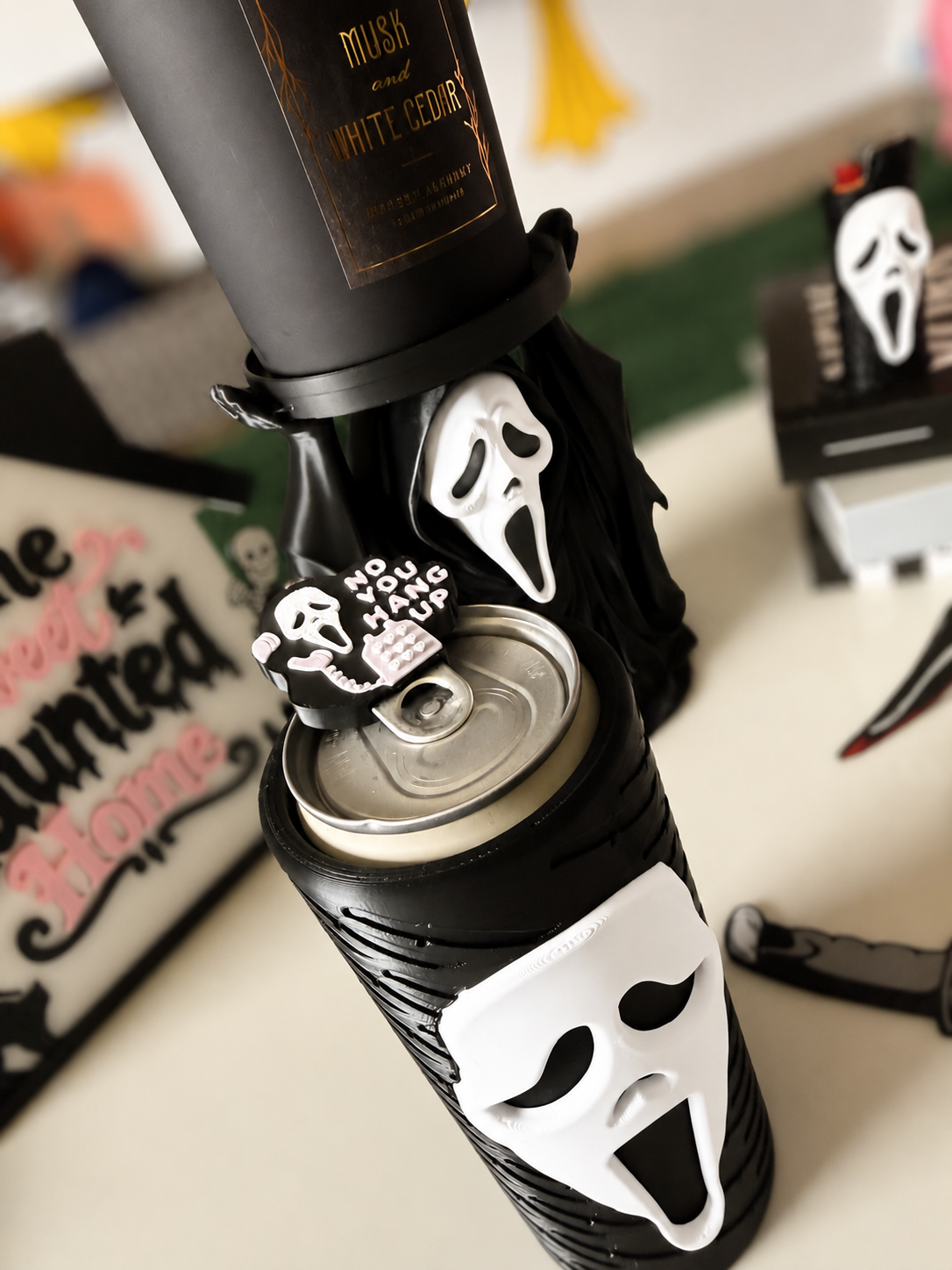 GhostFace can-tab opener in use with softly blurred background