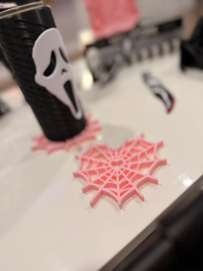 Pink heart spiderweb coaster displayed under a slim can holder