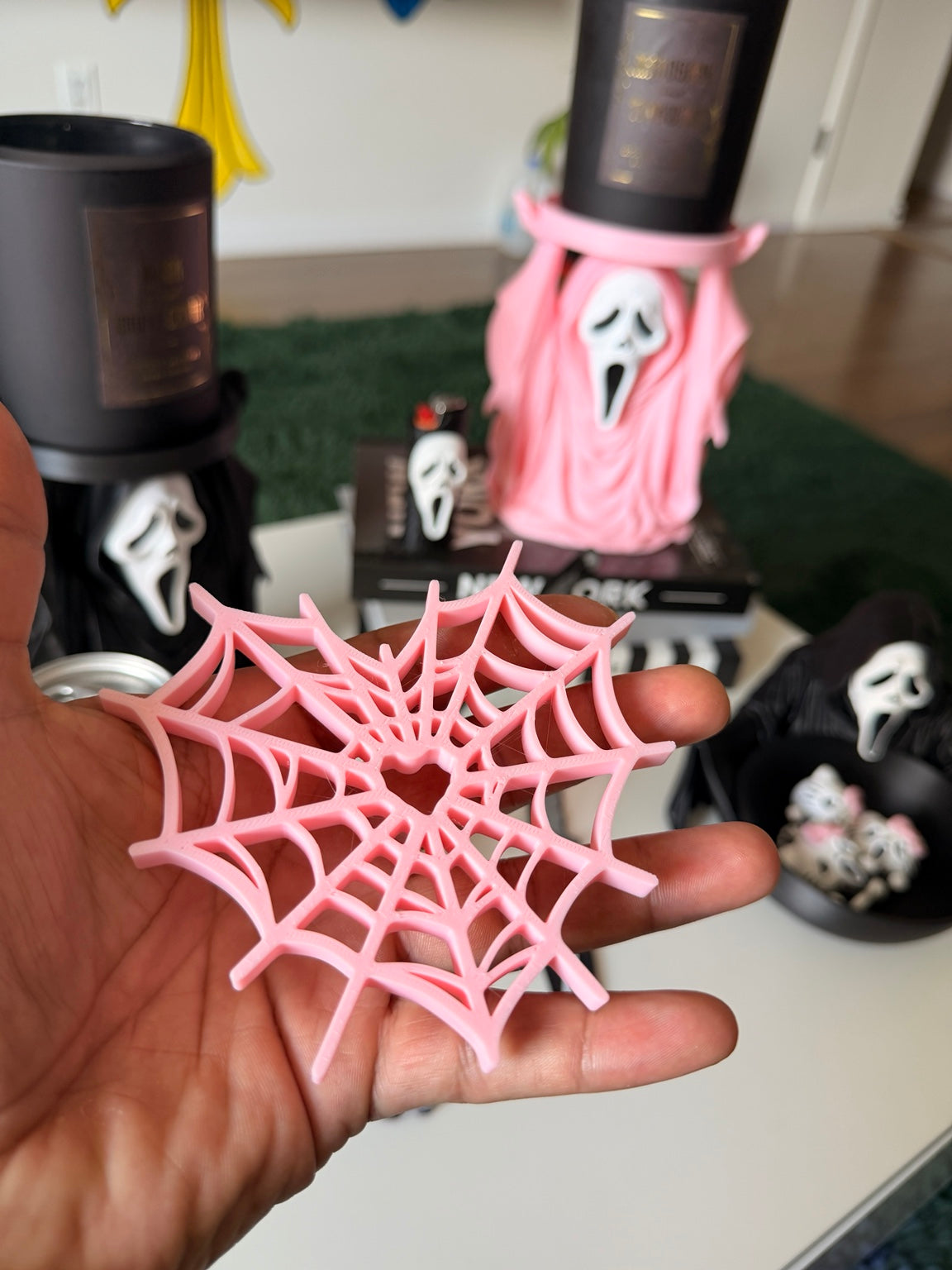 Pink heart-shaped spiderweb coaster from a four-piece set